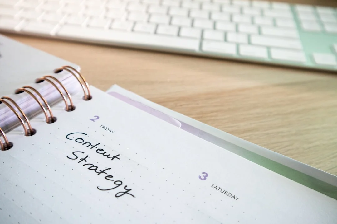 Elegant flat lay of branding strategy documents with a natural twig accent.